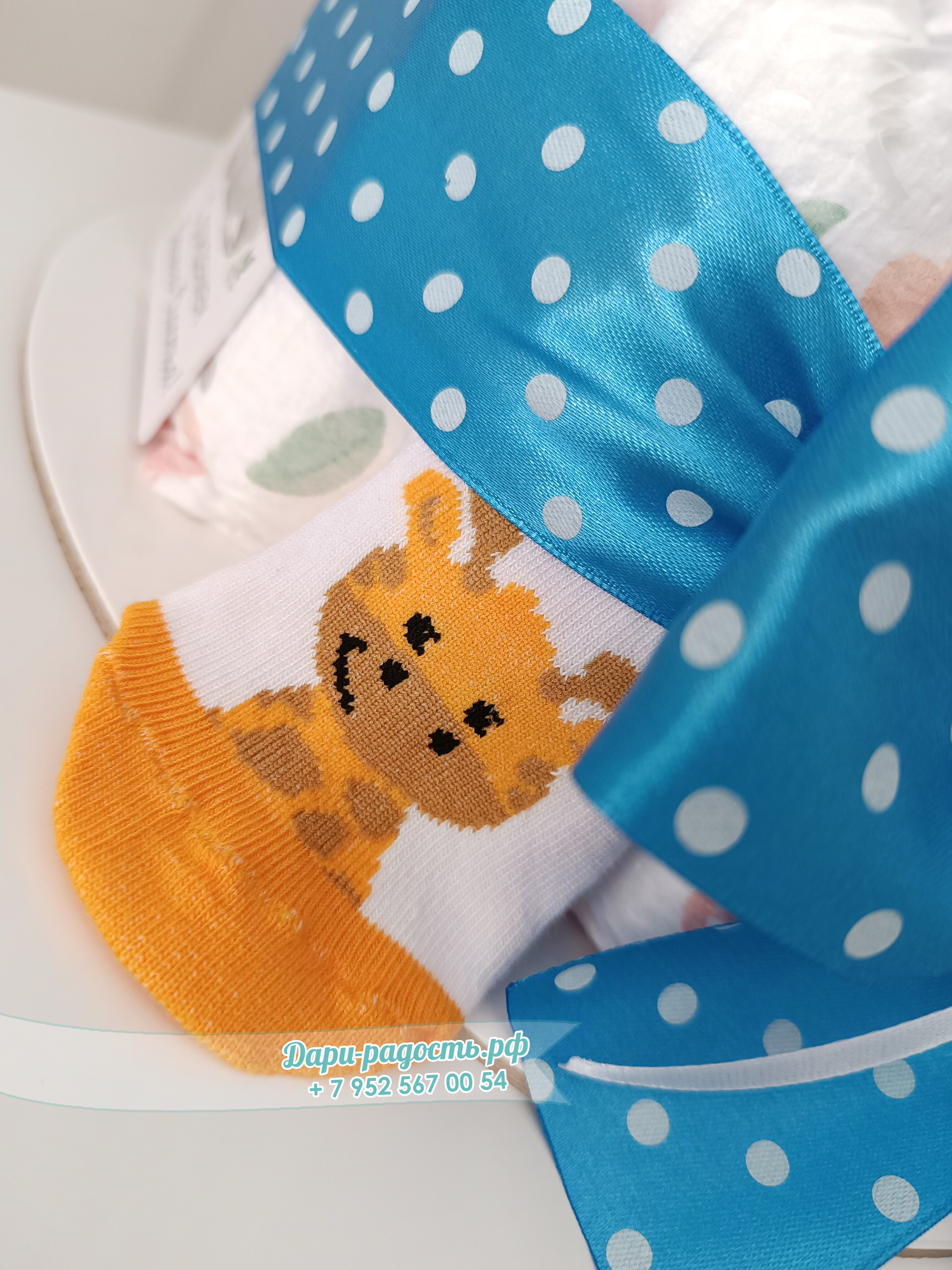 Торт из памперсов "Жирафик" на рождение мальчика